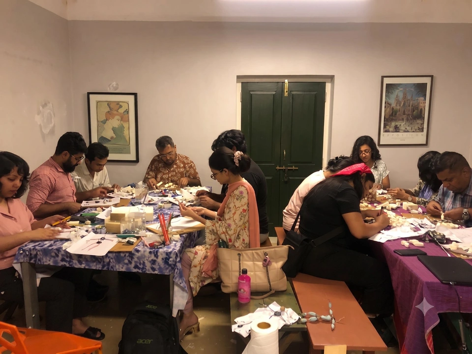 Students and artists making puppets together inside the studio